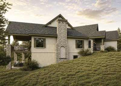 Modern home with cream-colored stucco walls, prominent stone chimney in center, and covered deck areas on both left and right sides built into sloped terrain.
